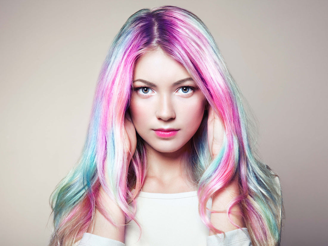 Colorful fashion portrait photographed against a soft neutral studio background