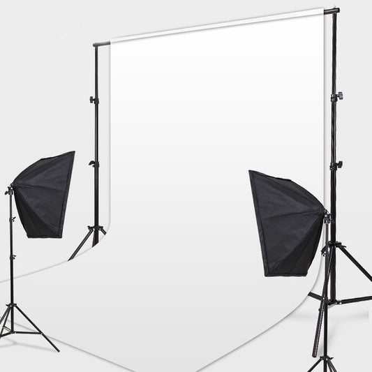Adjustable photography backdrop stand set up in a studio